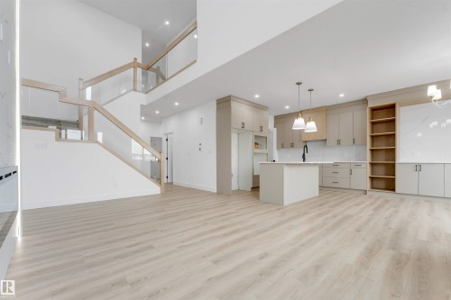 Open-concept living area with light wood-finish flooring - 4234 63 Street, Beaumont, AB - Indoor Photo Showing Kitchen