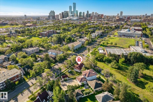 Urban setting with a prominent city skyline, residential streets, and mature trees - 11008 109 Street Nw, Edmonton, AB 