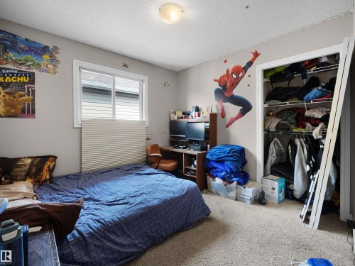Bedroom featuring light-colored walls and neutral carpet flooring - 1216 29 Avenue Nw, Edmonton, AB - Indoor Photo Showing Bedroom