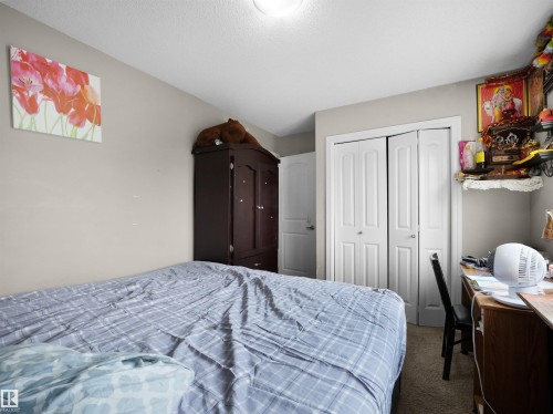 Interior room featuring neutral wall paint and light-colored carpeting - 1216 29 Avenue Nw, Edmonton, AB - Indoor Photo Showing Bedroom