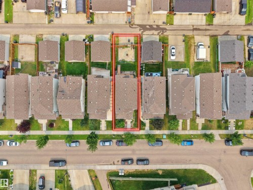 Property featuring a fenced backyard with a patio area and mature trees - 1216 29 Avenue Nw, Edmonton, AB - Other