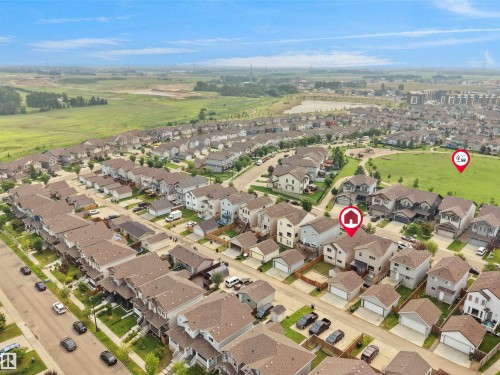 Aerial perspective showcasing a residential development with varied housing styles - 1216 29 Avenue Nw, Edmonton, AB - Outdoor With View