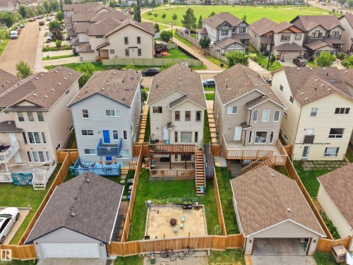 Rear exterior featuring a multi-level deck, fenced yard, and detached garage - 1216 29 Avenue Nw, Edmonton, AB - Outdoor
