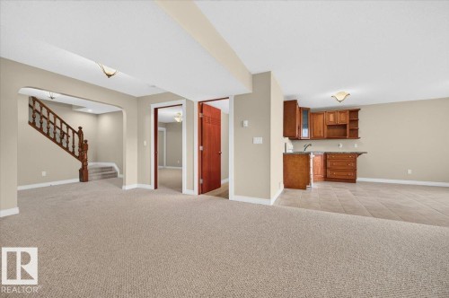 Integrated kitchenette with wood cabinetry - #7 10500 103 Av, Morinville, AB 