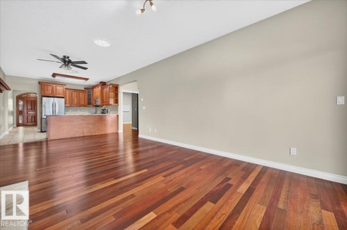 Hardwood flooring, recessed ceiling lighting, ceiling fan, wood-finish cabinetry, stainless steel appliances - #7 10500 103 Av, Morinville, AB 
