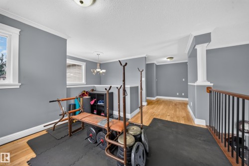 Hardwood flooring, painted walls, white trim, recessed lighting, colonial columns - 6904 18 Avenue Sw, Edmonton, AB 