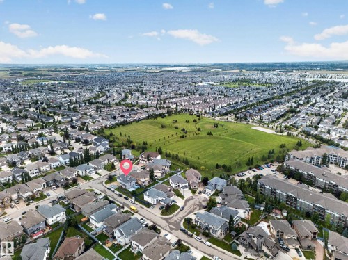 Residential neighborhood featuring single-family homes, multi-story residential buildings, and open green spaces - 6904 18 Avenue Sw, Edmonton, AB 