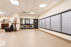 Mailroom with extensive individual mailboxes and tile flooring - 