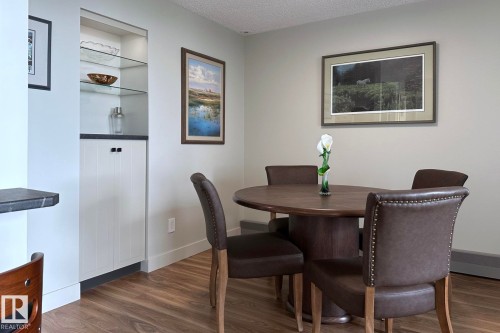 Built-in cabinetry with glass shelving and countertop - #2005 10149 Saskatchewan Dr Nw, Edmonton, AB 
