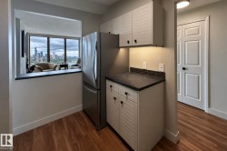 Stainless steel refrigerator with wood-finish flooring - 