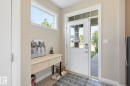 Entryway featuring a white door with divided lites, a full-length sidelight, and a transom window above - 3204 Abbott Crescent Sw, Edmonton, AB  - Indoor Photo Showing Other Room 