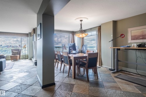 Natural stone tile flooring throughout - #1202 10010 119 St Nw, Edmonton, AB 