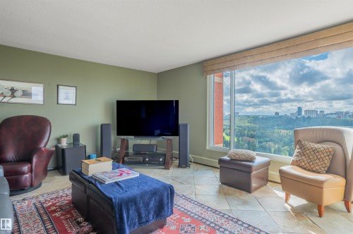 Expansive floor-to-ceiling window, roller shade, pale green walls, and tiled flooring - #1202 10010 119 St Nw, Edmonton, AB 
