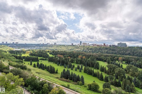 Expansive green space with mature trees and distant city skyline - #1202 10010 119 St Nw, Edmonton, AB 