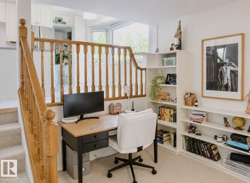 Oak wood banister and railing with carpeted stairs - 3911 117 Street Nw, Edmonton, AB 