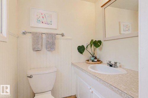Built-in vanity with an integrated sink and chrome faucet - 3911 117 Street Nw, Edmonton, AB 