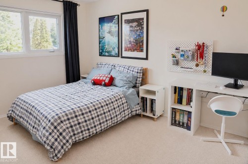 Bright room with two windows, light-colored walls, and carpeting - 3911 117 Street Nw, Edmonton, AB 