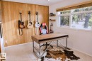 Feature wall with wood-paneled detailing and wall-mounted shelving - 3911 117 Street Nw, Edmonton, AB 