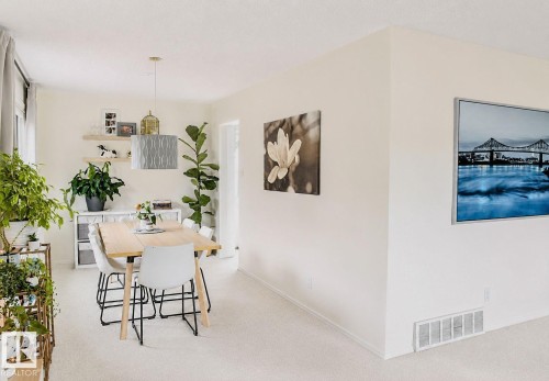 Recessed lighting, wood-finish shelving, and a modern pendant light - 3911 117 Street Nw, Edmonton, AB 