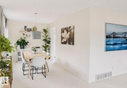 Recessed lighting, wood-finish shelving, and a modern pendant light - 