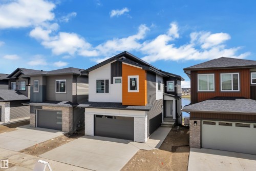 Contemporary exterior with contrasting siding, attached garage, and concrete driveway - 226 Linden Loop, Leduc, AB 