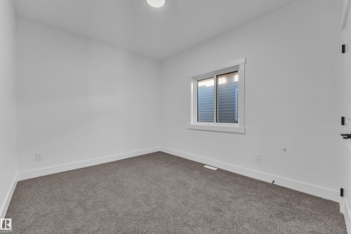 Neutral wall finishes, recessed lighting, and grey carpeting - 226 Linden Loop, Leduc, AB 
