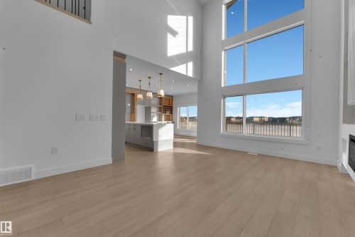 Expansive open-concept living space with high ceilings and wood-finish flooring - 226 Linden Loop, Leduc, AB 