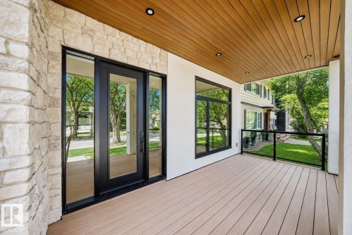 Stone veneer exterior featuring a wood-finish ceiling with recessed lighting - 10514 134 Street Nw, Edmonton, AB 