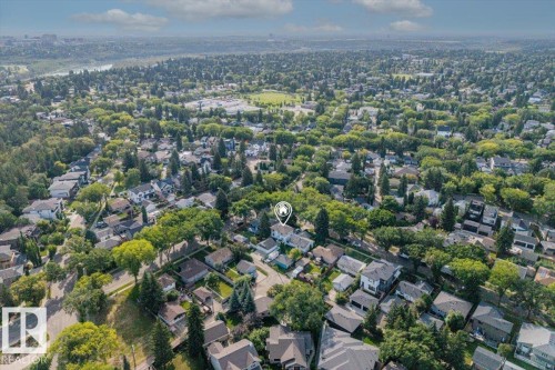 Expansive residential area featuring numerous mature trees and a park space - 14608 93 Avenue Nw, Edmonton, AB 