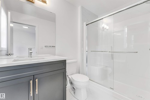 Modern vanity with a light countertop and chrome faucet - #48 710 Mattson Dr Sw Sw, Edmonton, AB 