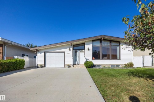 Single-story exterior with white siding and brown trim - 14008 94 Street Nw, Edmonton, AB 