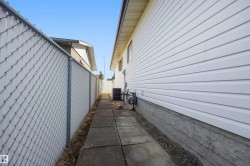 White horizontal siding exterior with a concrete foundation - 