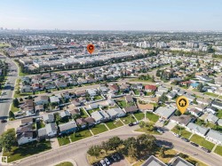 Aerial perspective showcasing residential properties within an established neighborhood - 