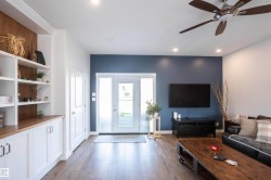 Living area featuring wood-finish flooring and recessed lighting - 