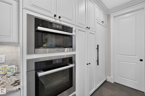Miele Oven, Miele Steam Oven, Miele Warming Drawer.  Subzero 36" Integrated All Fridge (with 2 drawers).  Subzero 36" Integrated All Freezer.  Gaggenau Induction Cooktop - 14308 97A Avenue Nw, Edmonton, AB 