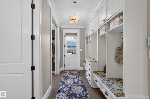 Mudroom with Lockers, walk In Closet and convenient access to a 2 pc bathroom. - 14308 97A Avenue Nw, Edmonton, AB 