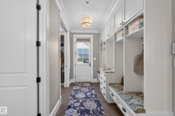 Mudroom with Lockers, walk In Closet and convenient access to a 2 pc bathroom. - 
