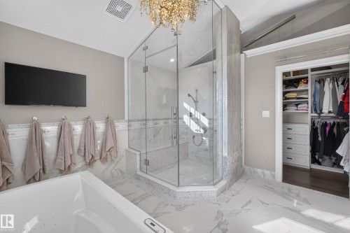 Stunning Steam Shower with custom marble tile.  Water features including Fixed Head, handheld shower and 3 bodfsprays.  Bench and shower niche. - 14308 97A Avenue Nw, Edmonton, AB 
