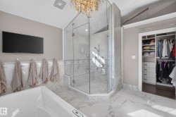 Stunning Steam Shower with custom marble tile.  Water features including Fixed Head, handheld shower and 3 bodfsprays.  Bench and shower niche. - 