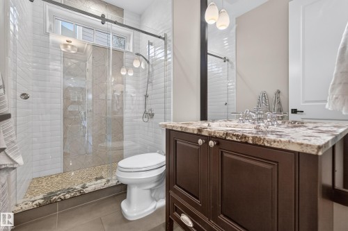 Main Floor 3 Pc Bathroom.  Luxury Natural Stone tile with Glass shower doors. - 14308 97A Avenue Nw, Edmonton, AB 