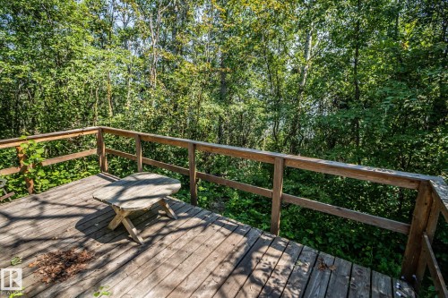 Expansive outdoor deck featuring wood flooring and a natural wood railing - 811 59209 Range Rd 95A, Rural St. Paul County, AB - Outdoor With Deck Patio Veranda