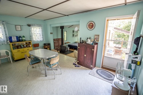 Bright interior space featuring light blue walls and a light-toned flooring - 811 59209 Range Rd 95A, Rural St. Paul County, AB - Indoor