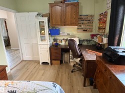 Light wood-finish flooring throughout the space - 