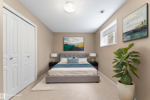 Recessed lighting, flush mount ceiling light, white bi-fold closet doors, wall-mounted window, neutral wall color - 2060 Brennan Crescent Nw, Edmonton, AB 