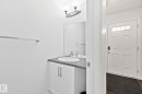 White paneled door with transom window - 9523 Simpson Court Nw, Edmonton, AB 