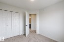 Neutral-toned carpeting complements clean white walls - 3603 40 Avenue, Beaumont, AB  - Indoor 