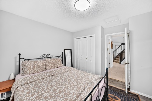Recessed lighting, wood-finish flooring, and bi-fold closet doors - 4216 47 Street Nw, Edmonton, AB 