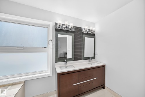 Dual vanity with integrated sinks and white countertops - 4216 47 Street Nw, Edmonton, AB 