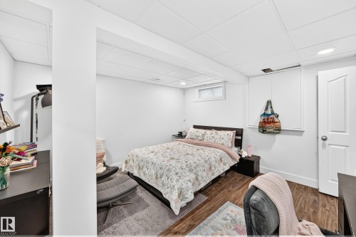 Wood-finish flooring, white walls, and a drop ceiling with recessed lighting - 4216 47 Street Nw, Edmonton, AB 