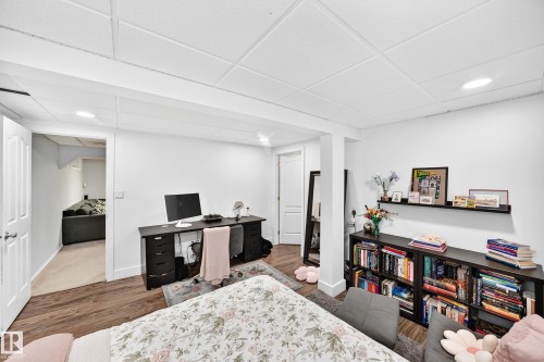 Wood-finish flooring, recessed lighting, and a drop-panel ceiling - 4216 47 Street Nw, Edmonton, AB 